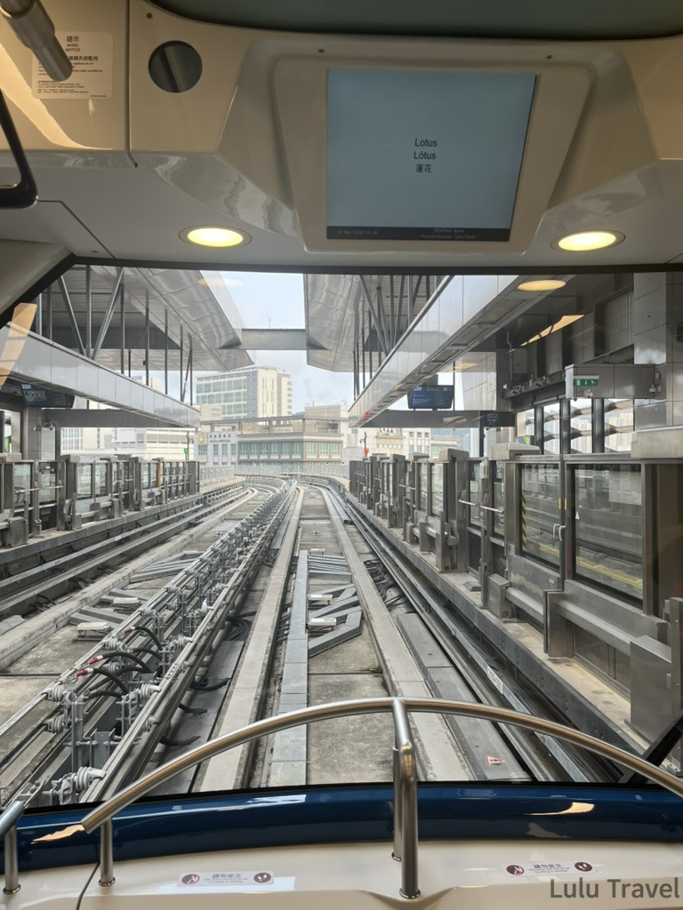 Accidental Macau Travel: A Spontaneous 2-Day Macau Self-Guided Itinerary 澳門輕軌 LRT 車頭視角,無人駕駛列車駛入蓮花站,顯示板標示 Lotus 蓮花站名